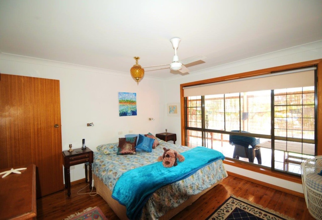 Bedroom at Creek St River House. A pet friendly accommodation beach house with dog friendly beaches for your holiday at Nambucca Heads near Valla Beach, Mid North Coast NSW 